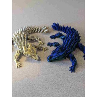 3D printed articulated baby dragon toys in gold and blue