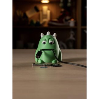 3D printed green Cable Monster desk helper holding cables