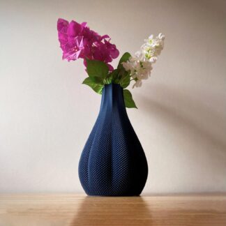 3D printed navy blue textured vase with pink and white flowers
