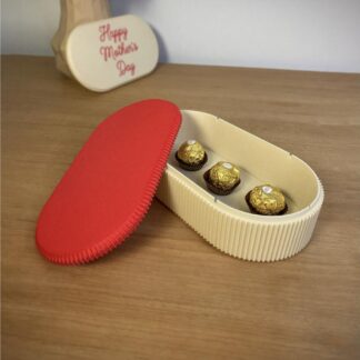 3D printed Rinzo oval gift box with lid, open showing chocolates