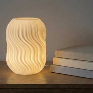 3D printed wave lamp shade illuminated on nightstand
